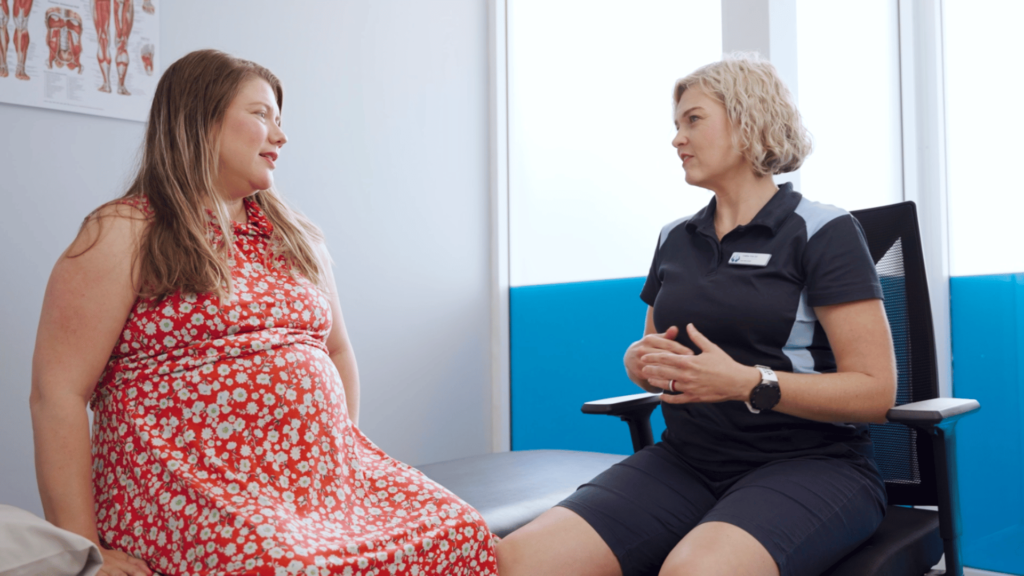 Personalised 1-on-1 consultation at Assist Allied Health, featuring a physiotherapist providing care to a pregnant woman with tailored solutions.